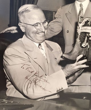 [President Harry Truman Receives a Gift of Cowboy Boots].