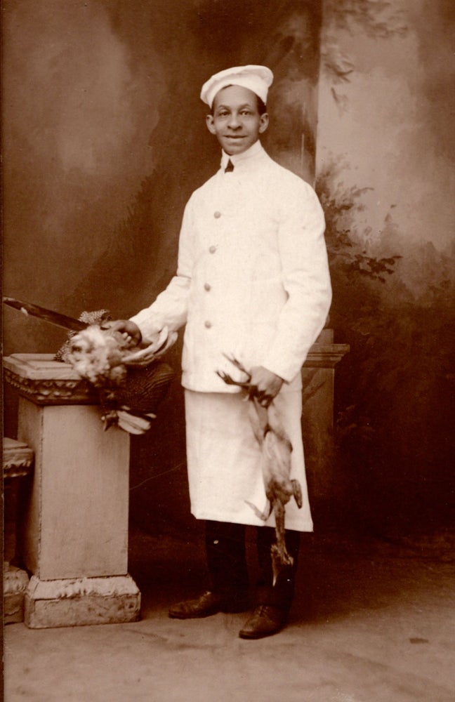 Item #5995 [An African American chef with fowl.]. Wuttge’s Photo Studio.