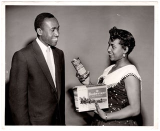 [Lot of photographs of an African American Budweiser representative.]
