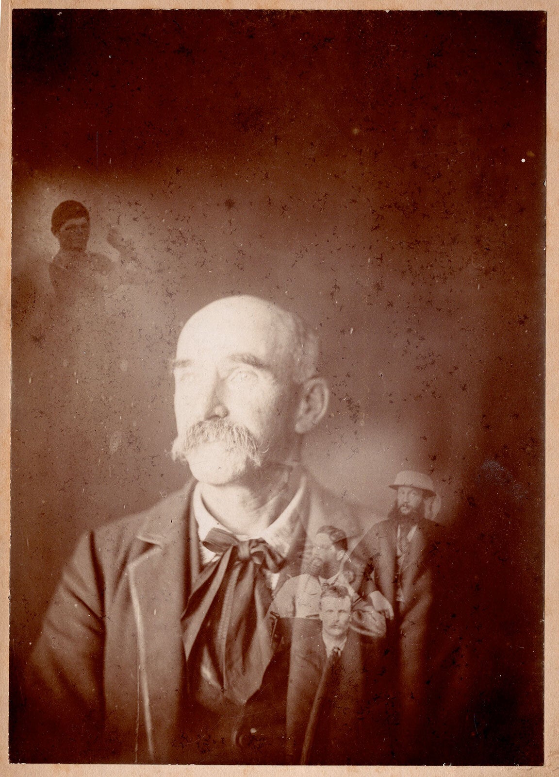 Mr. Townsen. Spirit photograph of man surrounded by four ghostly